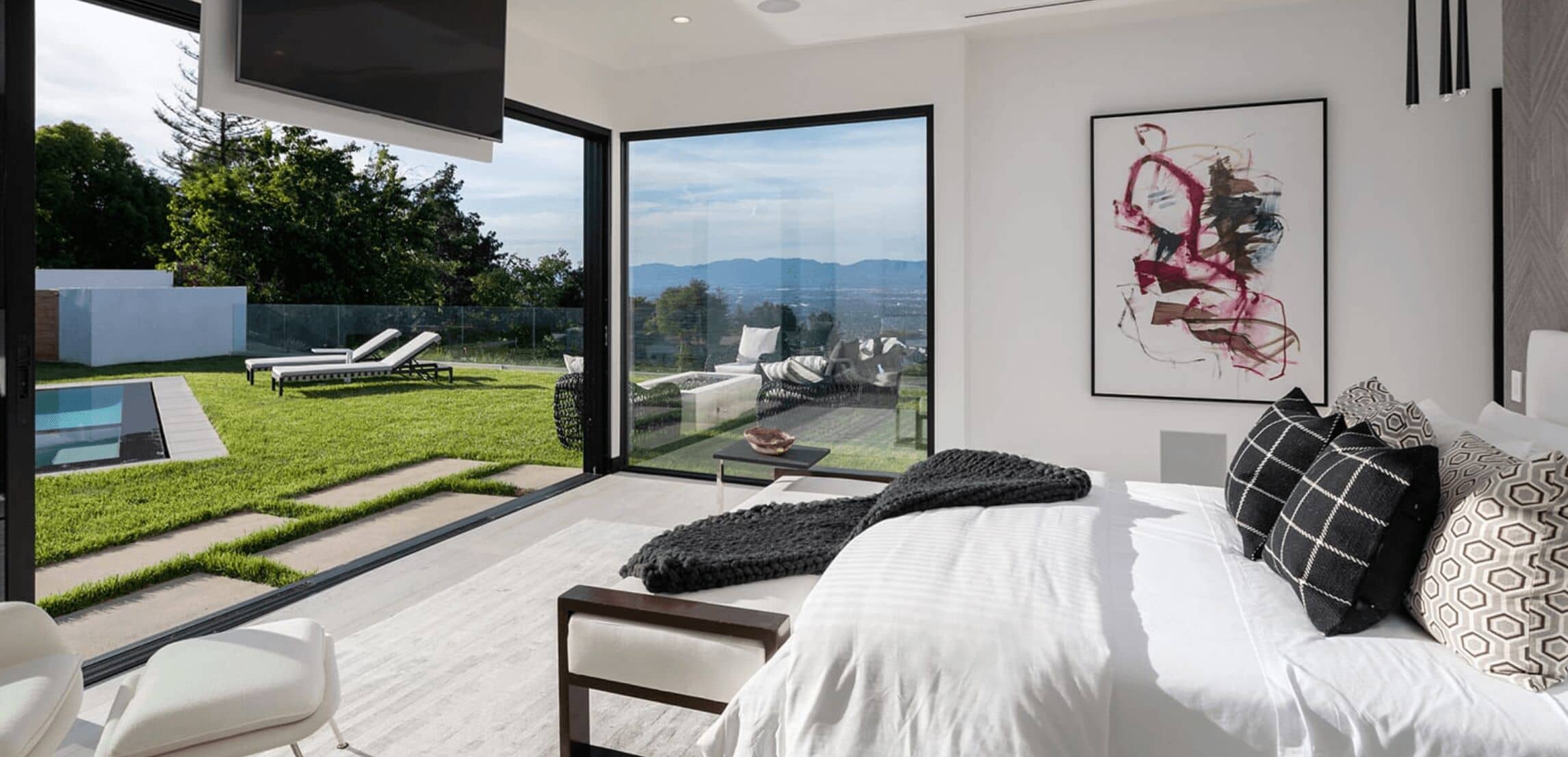 Bedroom opening to a backyard designed by an orange county architect in ca.