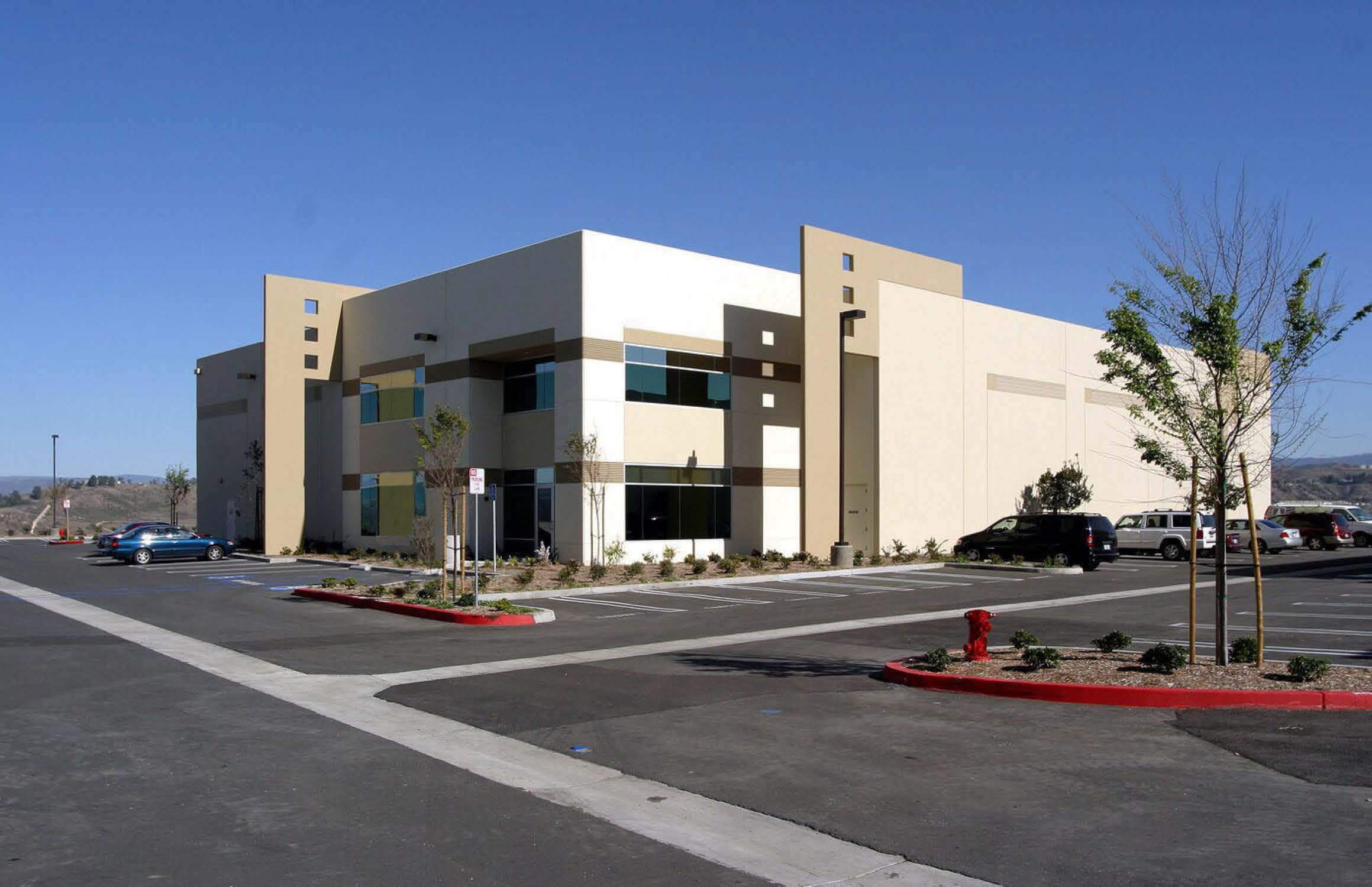 A commercial building and parking lot planned by an architect