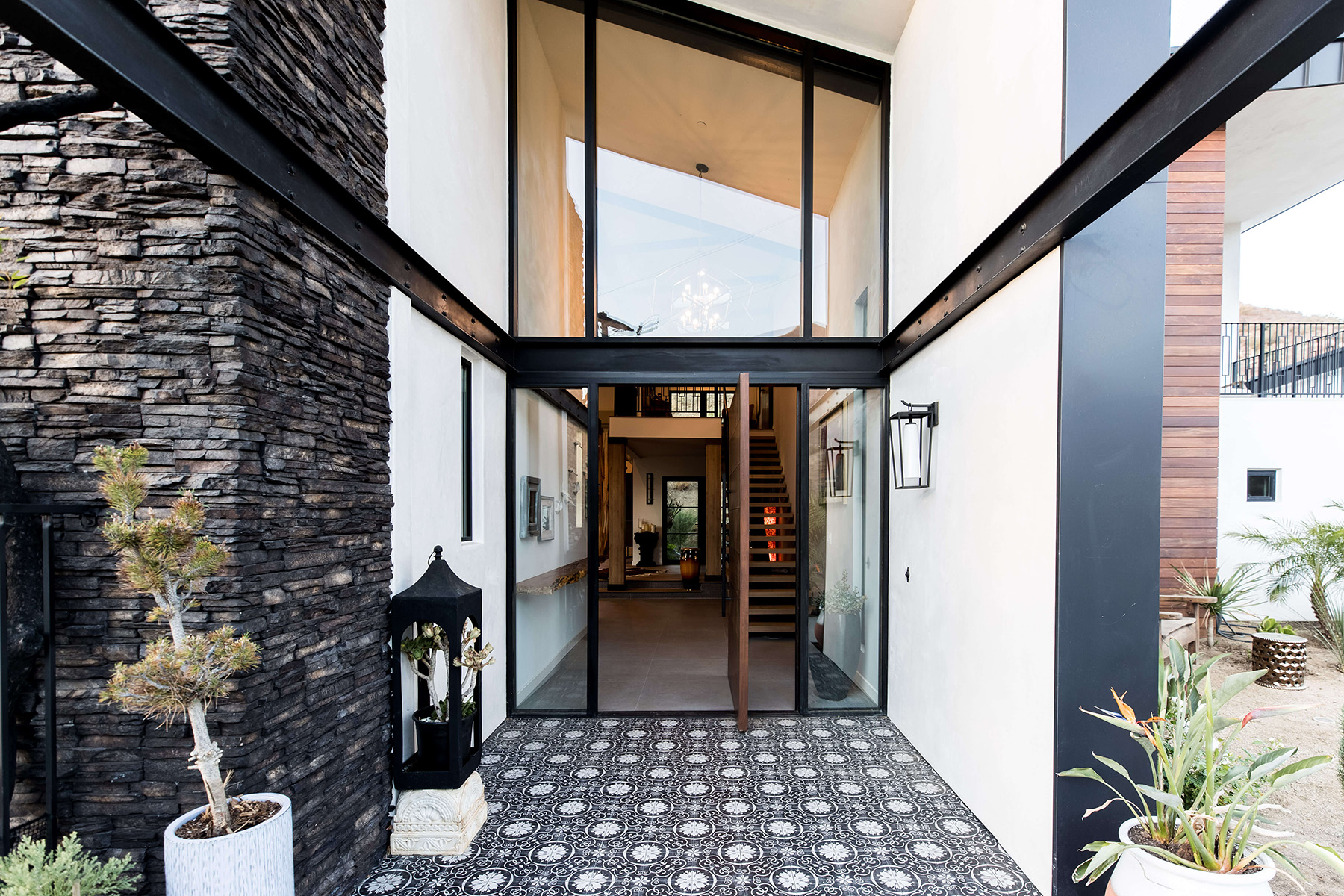 Entryway area to a modern home with the door open