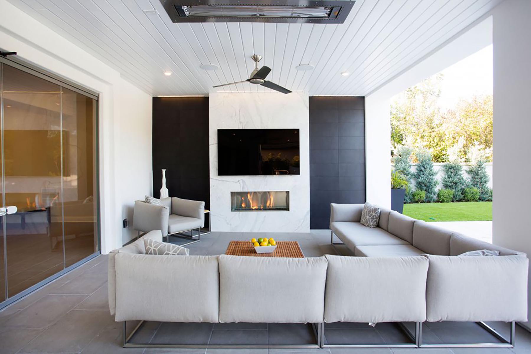 A home addition with a couch and tv