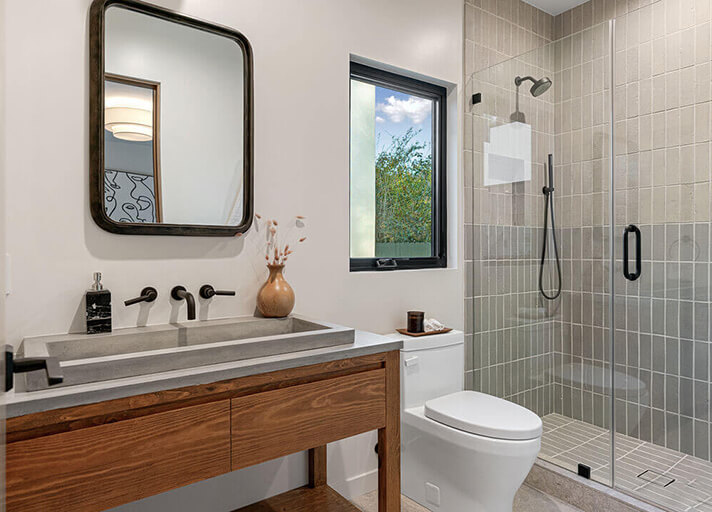 Remodeled guest bathroom with vanity