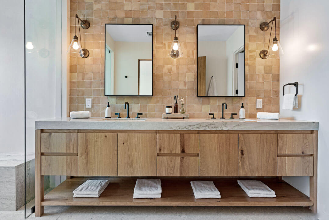 Master bathroom with custom vanity of wood and marble