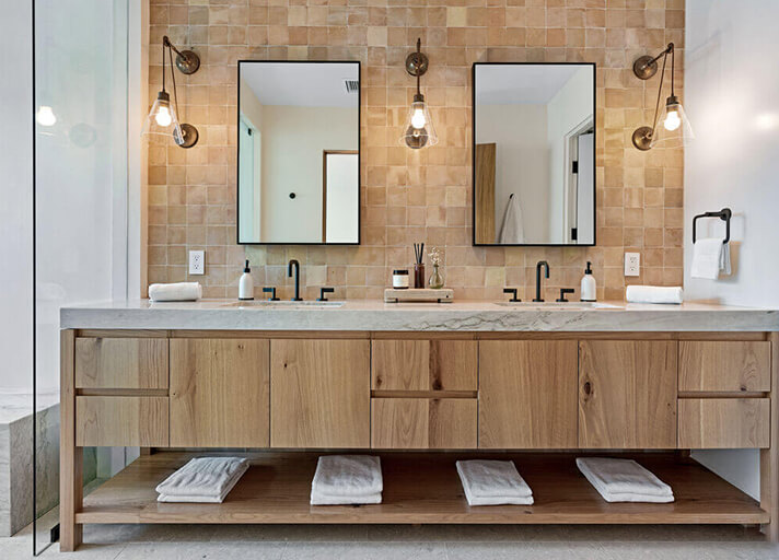 Master bathroom with custom vanity of wood and marble