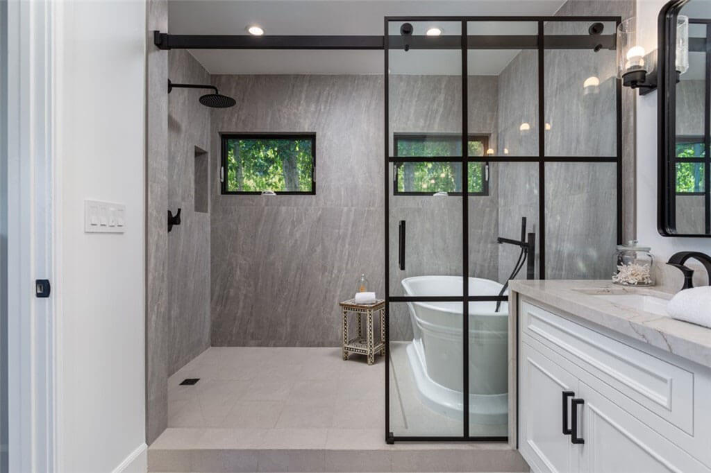 Master bathroom with dual vanity, large shower and free standing tub