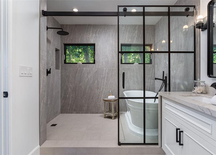 Master bathroom with dual vanity, large shower and free standing tub