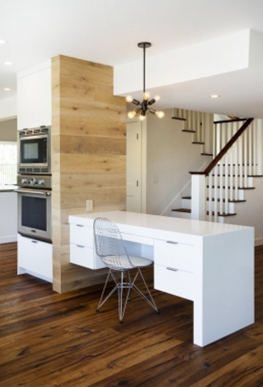 A desk repurposed for kitchen and office use