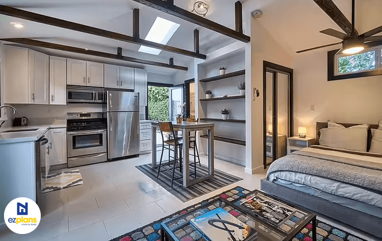 Interior of a studio ADU showing the bedroom, living and kitchen area layout.