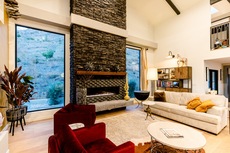 Spacious living room with a two-story fireplace